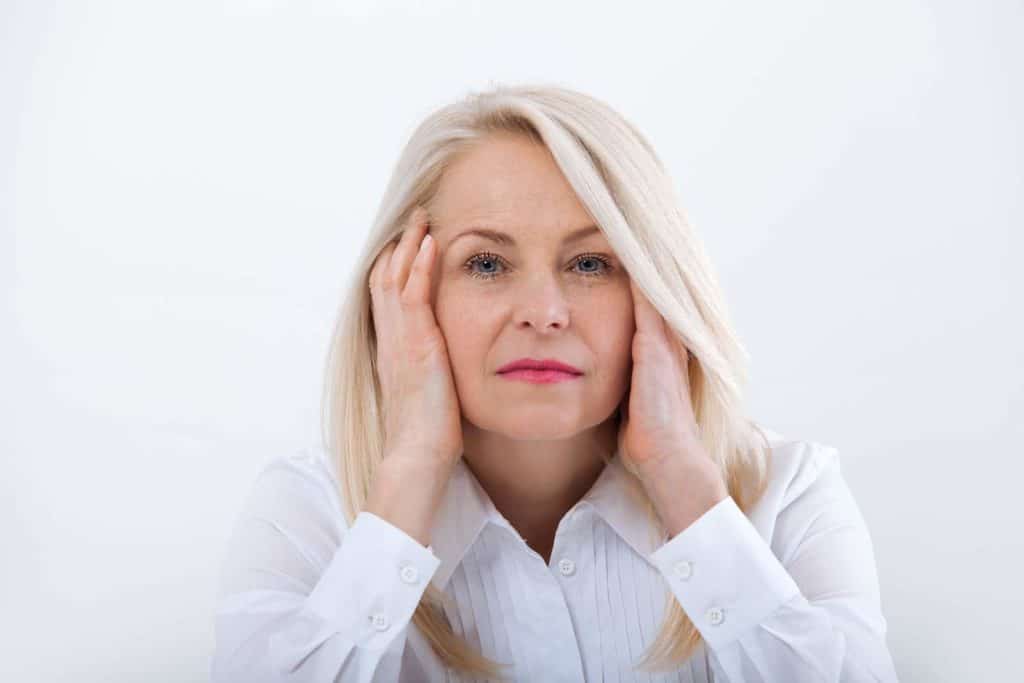 woman experiencing symptoms of menopause